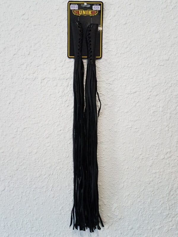 Black handlebar fringe hanging on wall