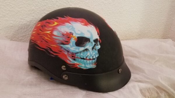 black helmet with skull and fire decal left angle