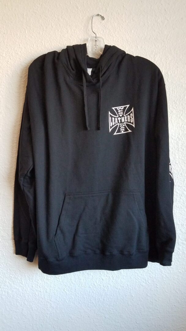 Black hoodie with white symbol on wall