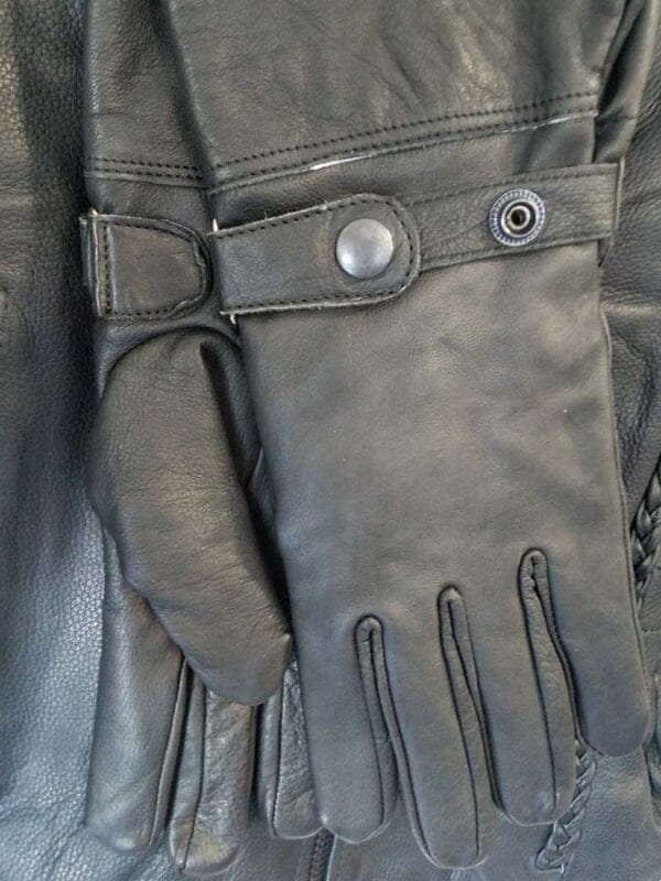 Closeup of jacket with snap button gloves